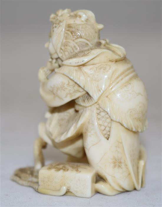 A Japanese ivory okimono of a bugaku dancer